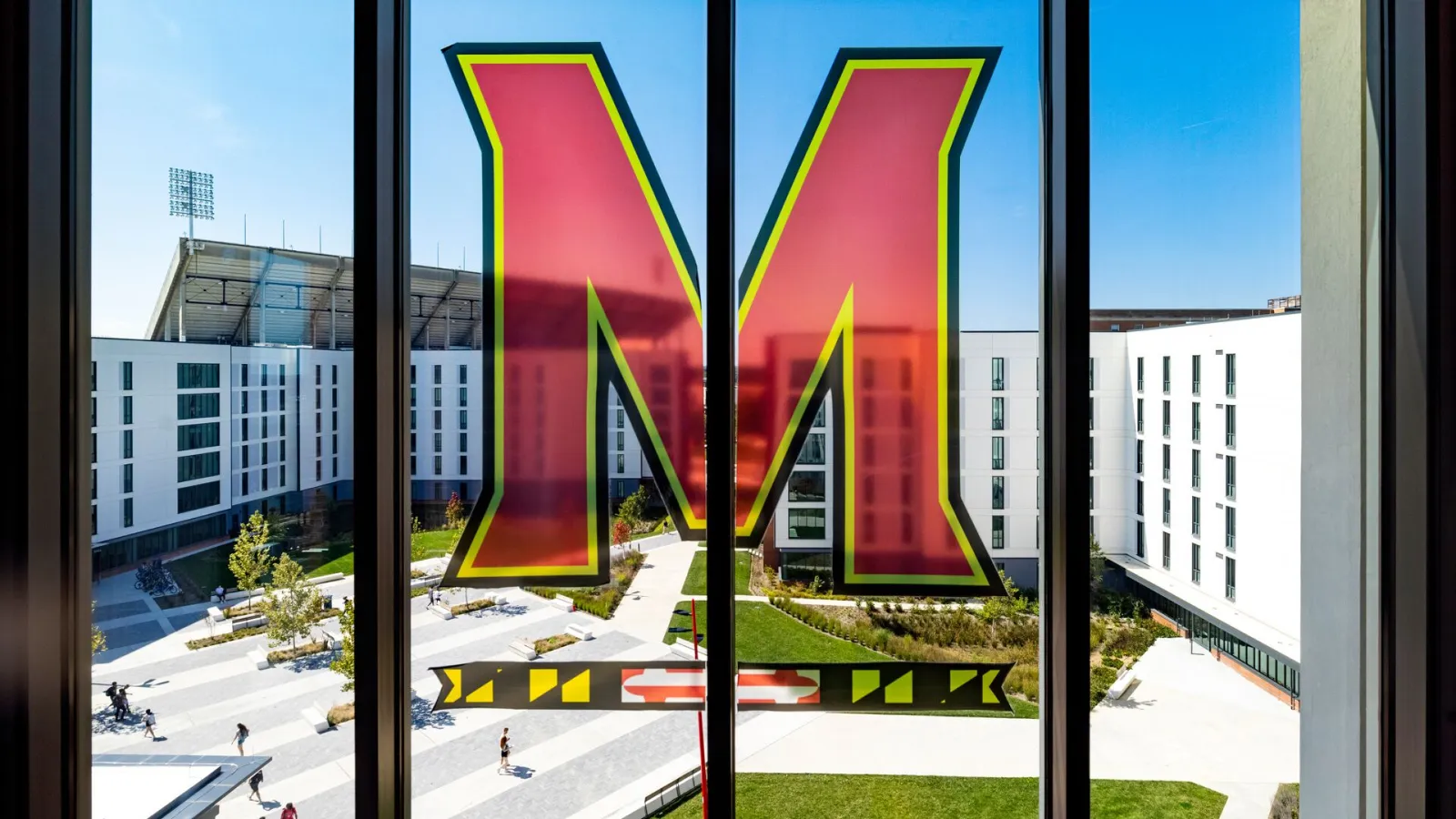 "M" on dorm room window facing other residence halls