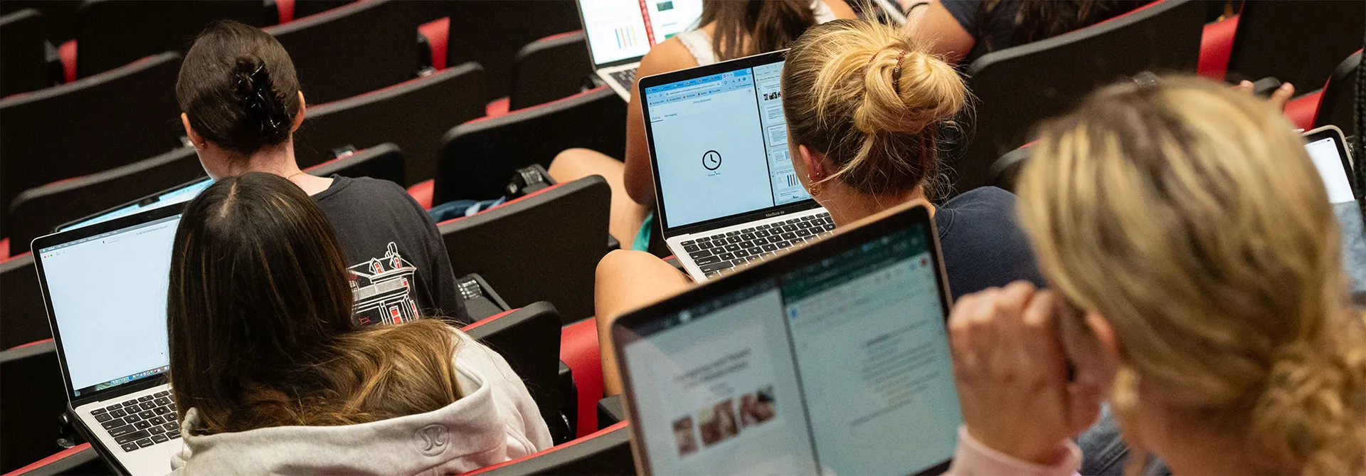 Students with laptops in a lecture hall