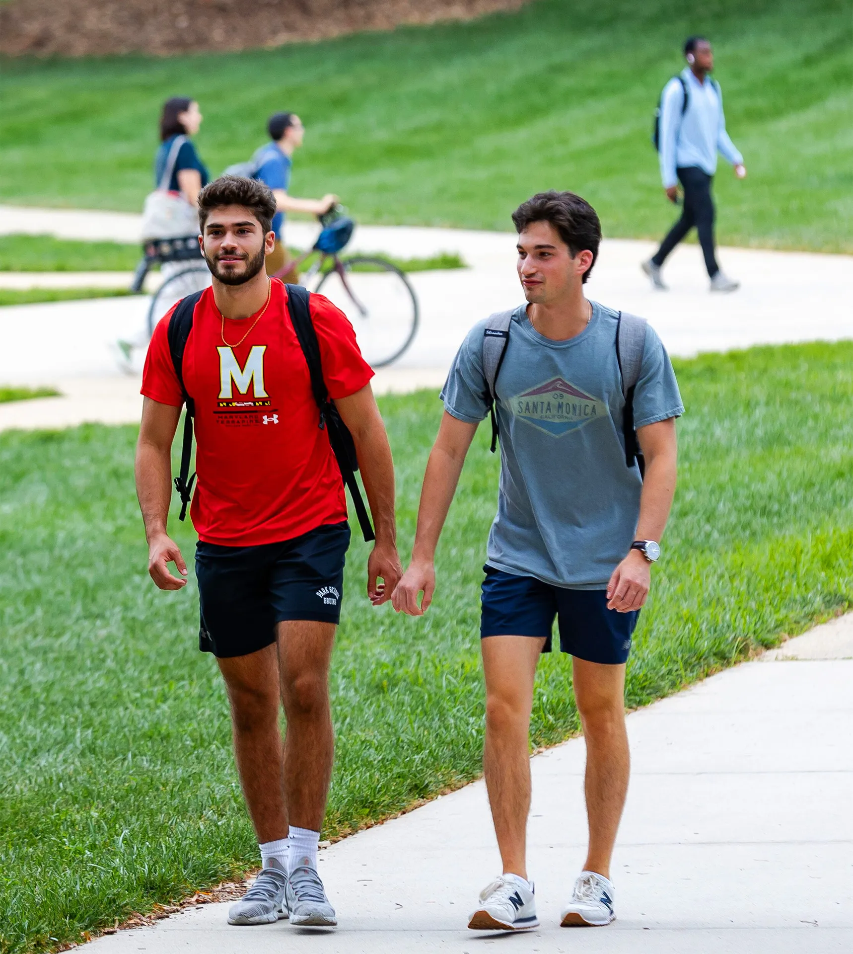 2 male students walking outside