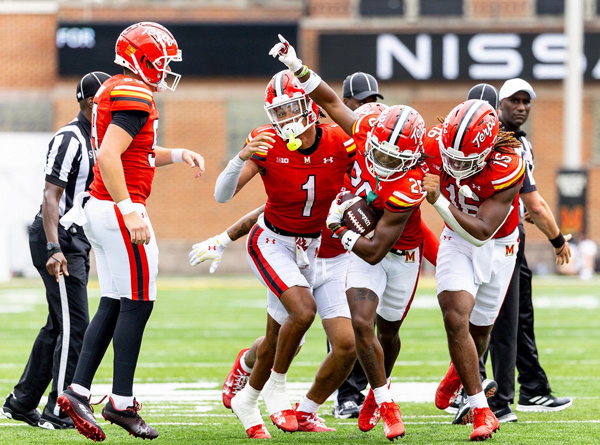 football players on the field with refs