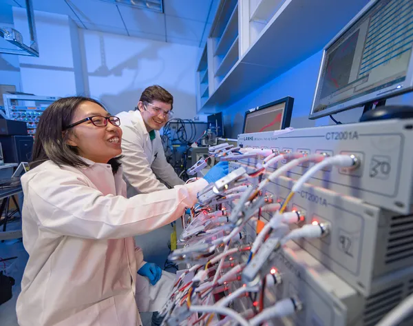 Engineering - Lab Battery - Researchers with machinery