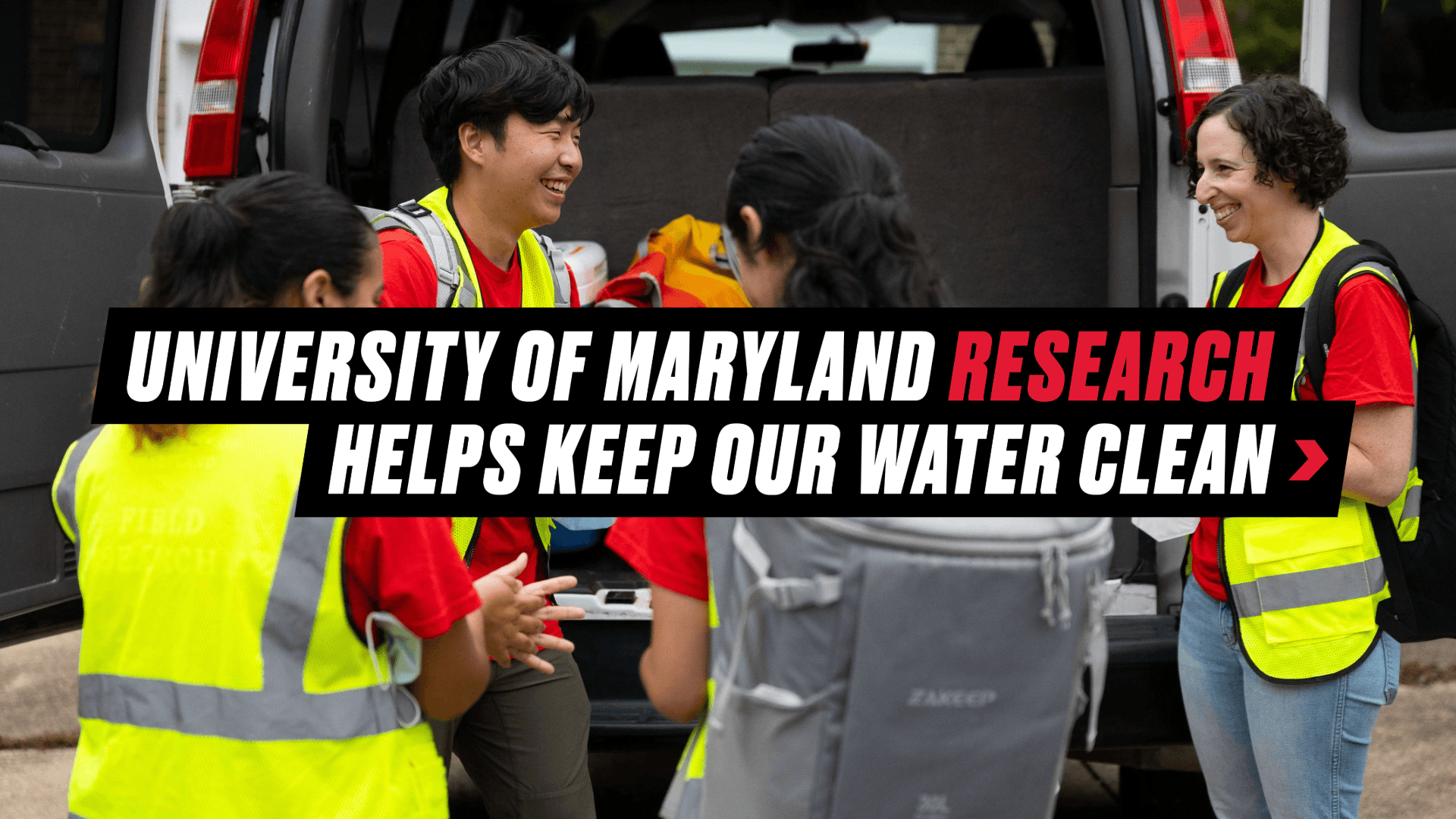 Graphic reading "University of Maryland Research Helps Keep Our Water Clean" over a background image of the Water Emergency Team in their field research uniforms laughing beside their equipment van