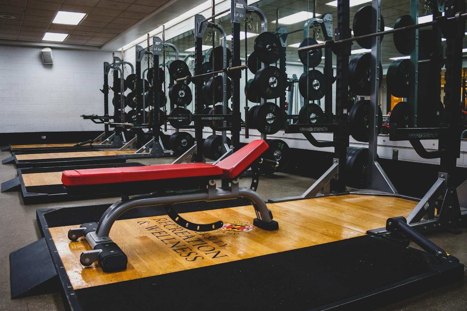 weightlifting benches and racks of weights