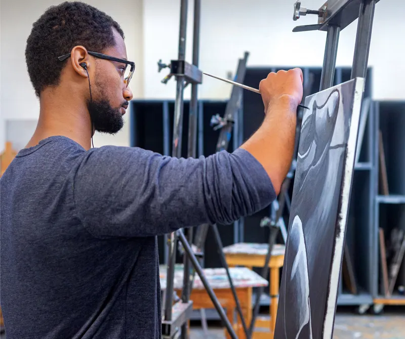 Student at artist's easel