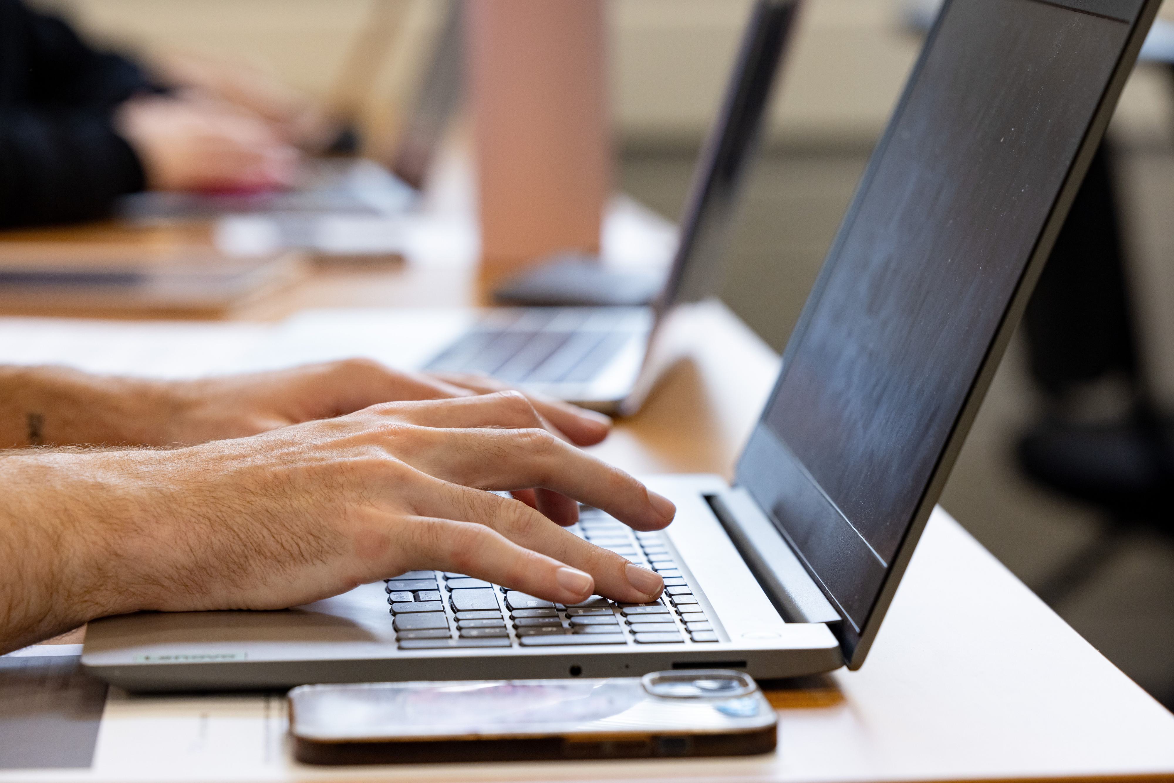close up of laptop typing