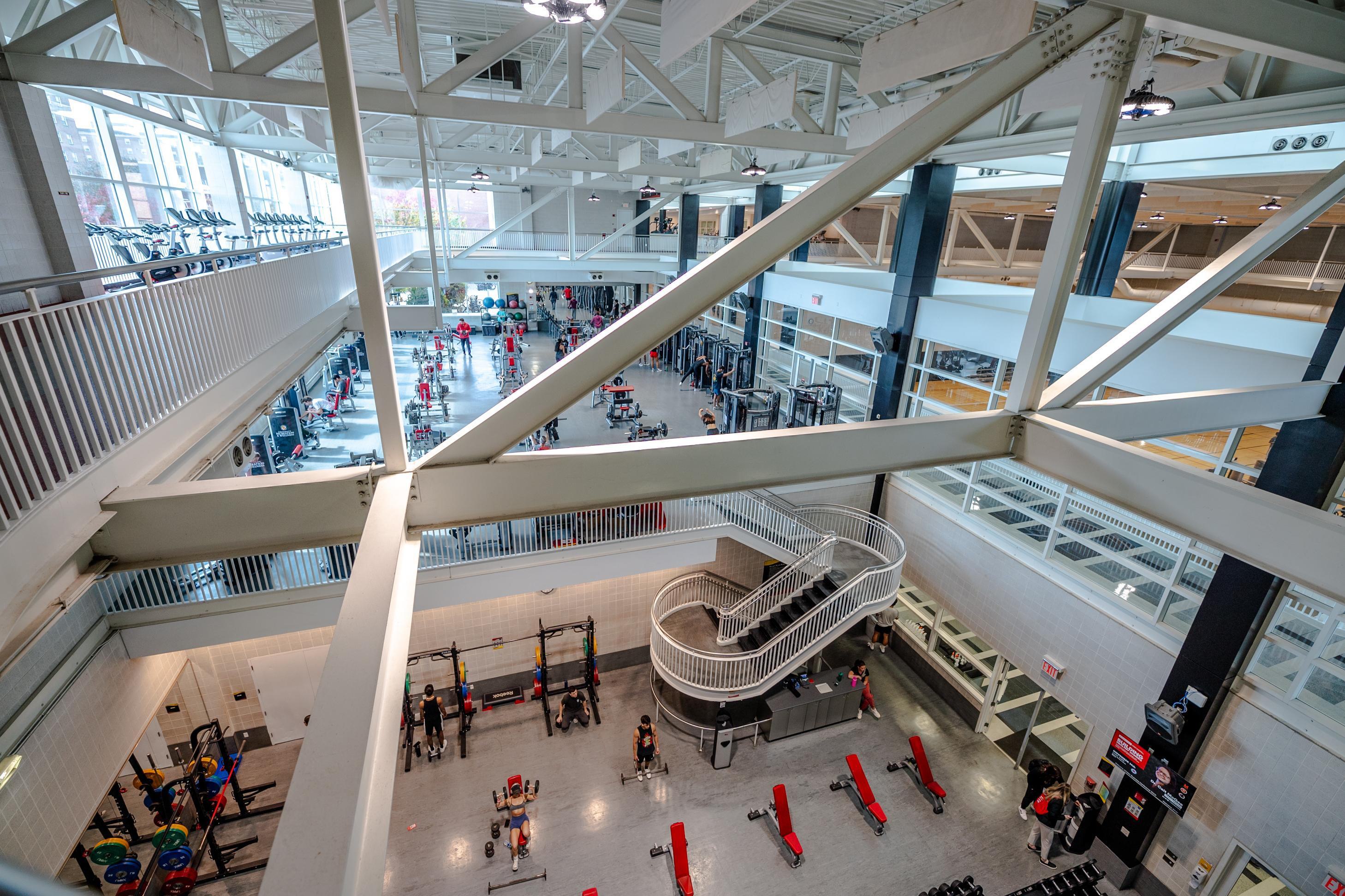 aerial view of large fitness center. A few people working out