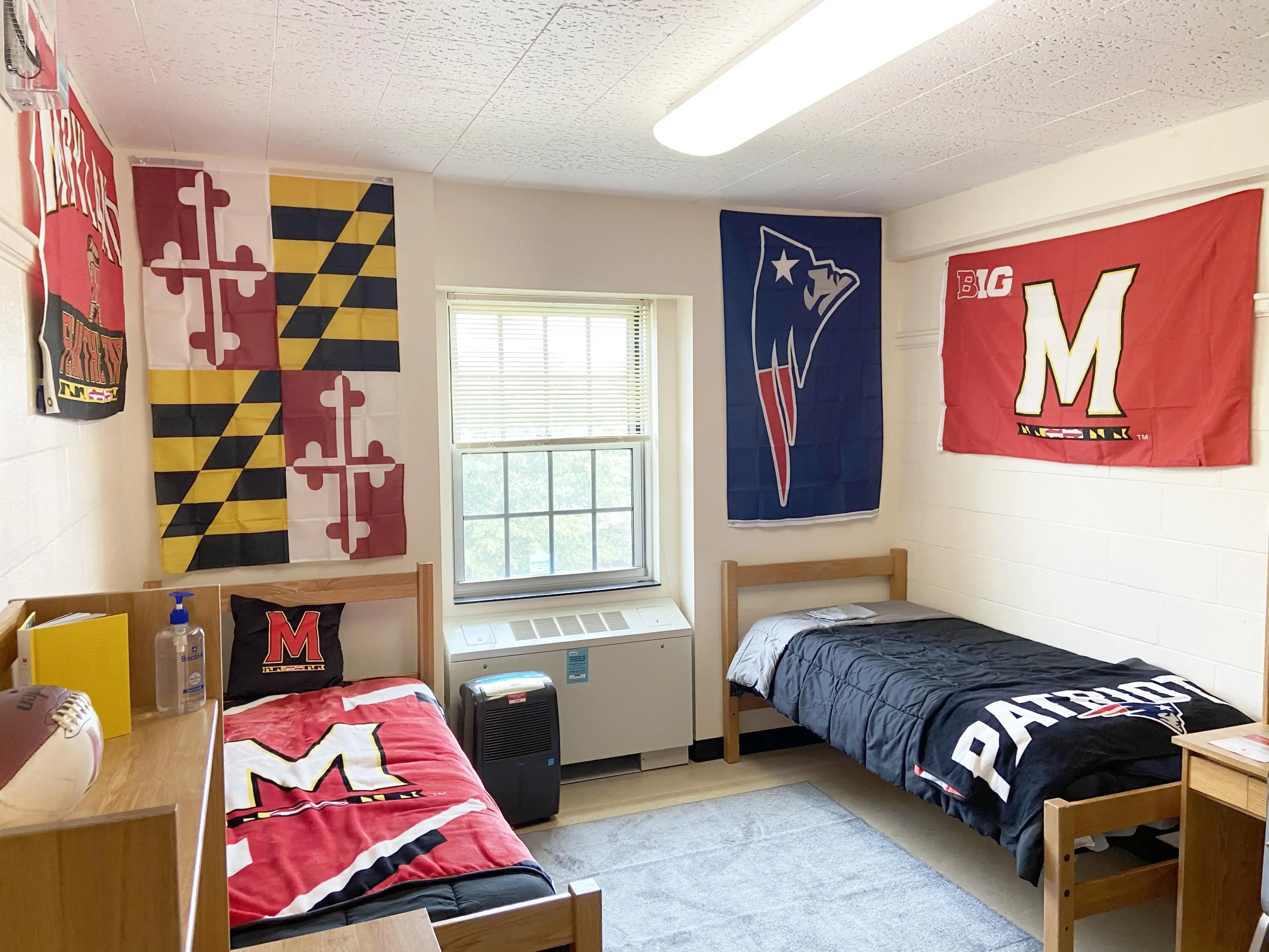 Room with sports pennants for Maryland Terrapins and New England Patriots